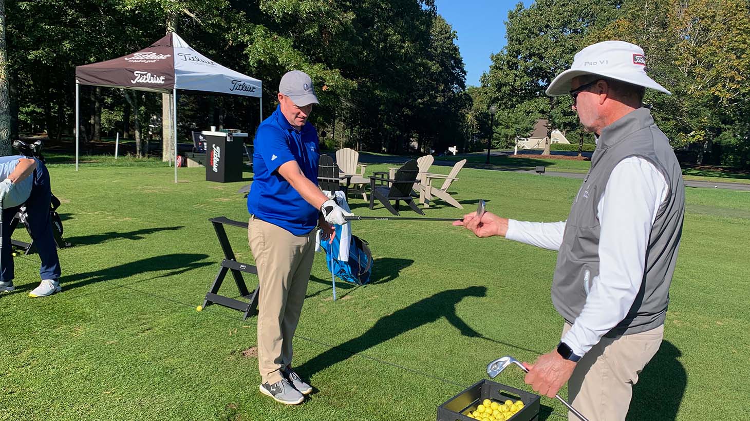 Mark makes a small adjustment to Andrew F.'s...